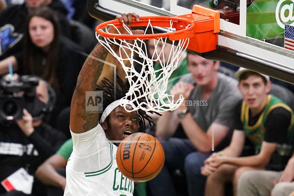 Charles Krupa Boston Celtics center Robert Williams III (44) slams a dunk against the Miami Heat during the first half of Game 4 of the NBA basketball playoffs Eastern Conference finals, Monday, May 23, 2022, in Boston. (AP Photo/Charles Krupa)