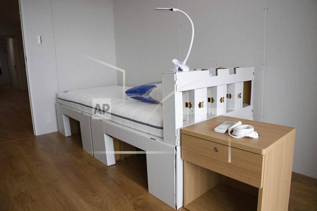 A recyclable cardboard bed and mattress for athletes are seen during a media tour at the Olympic and Paralympic Village for the Tokyo 2020 Games, constructed in the Harumi waterfront district of Tokyo, Sunday, June 20, 2021. (Akio Kon/Pool Photo via AP)