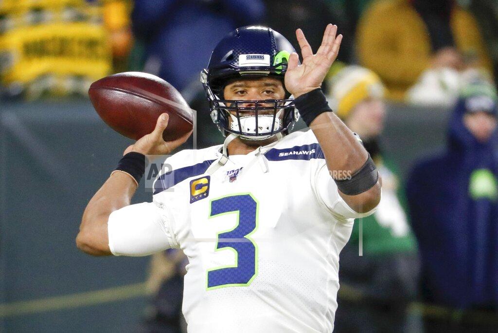 Matt Ludtke Seattle Seahawks quarterback Russell Wilson warms up before an NFL divisional playoff football game against the Green Bay Packers Sunday, Jan. 12, 2020, in Green Bay, Wis. (AP Photo/Matt Ludtke)