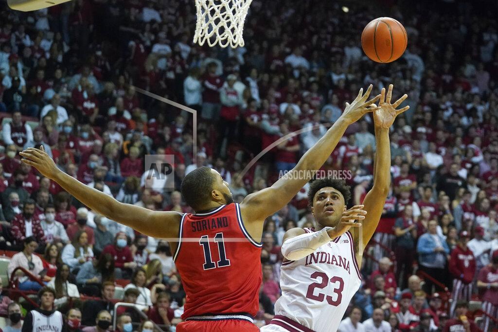 Darron Cummings Indiana's Trayce Jackson-Davis (23) shoots over St. John's Joel Soriano (11) during the second half of an NCAA college basketball game, Wednesday, Nov. 17, 2021, in Bloomington, Ind. Indiana won 76-74. (AP Photo/Darron Cummings)