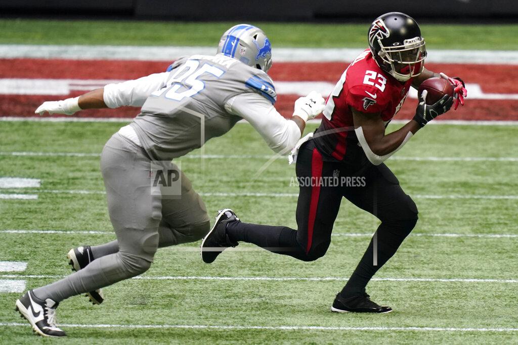 Brynn Anderson Atlanta Falcons running back Brian Hill (23) runs past Detroit Lions defensive end Romeo Okwara (95) during the first half of an NFL football game, Sunday, Oct. 25, 2020, in Atlanta. (AP Photo/Brynn Anderson)