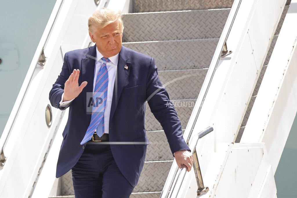 Ben Powell President Donald Trump waves as he arrives at Midland International Air and Space Port on Wednesday, July 29, 2020, in Midland, Texas. (Ben Powell/Odessa American via AP)