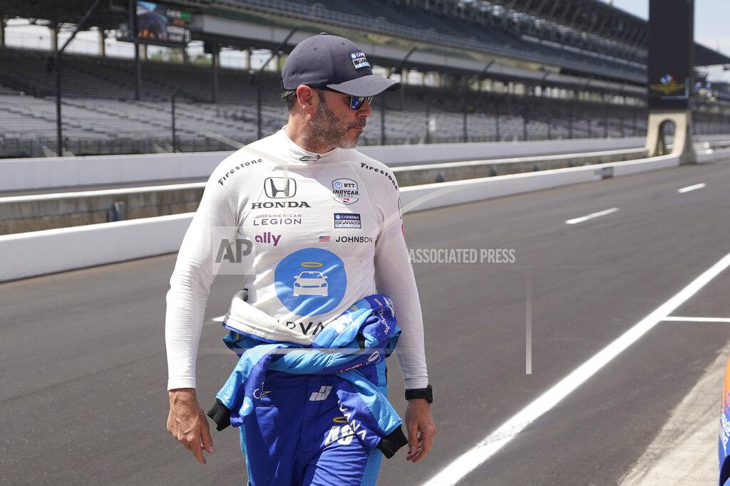 Darron Cummings Jimmie Johnson walks down pit lane during practice for the Indianapolis 500 auto race at Indianapolis Motor Speedway, Tuesday, May 17, 2022, in Indianapolis. (AP Photo/Darron Cummings)