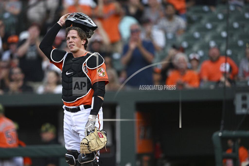 Gail Burton Baltimore Orioles' Adley Rutschman takes the field for his major league debut, against the Tampa Bay Rays in a baseball game Saturday, May 21, 2022, in Baltimore. (AP Photo/Gail Burton)