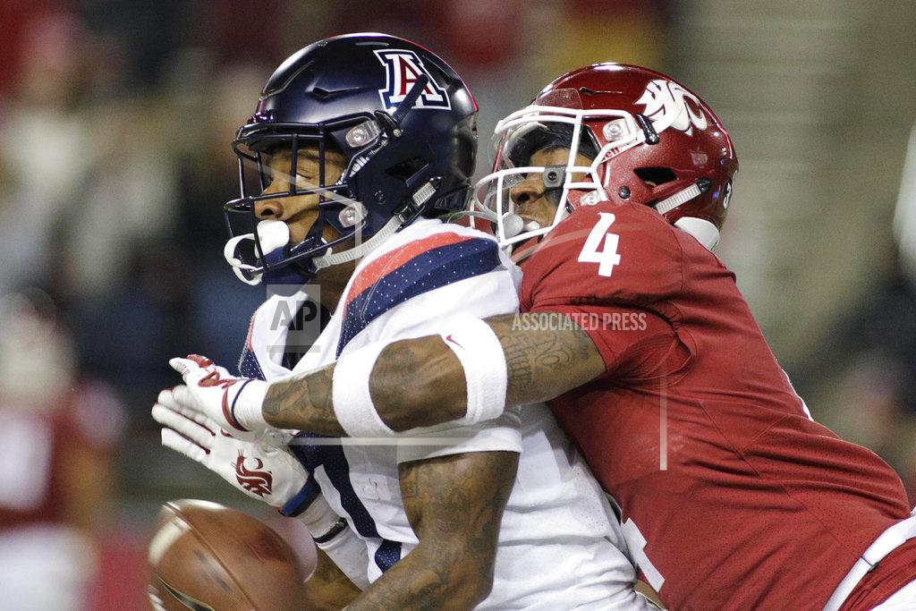 Young Kwak Arizona wide receiver Devaughn Cooper, left, catches a pass while defended by Washington State cornerback Marcus Strong (4) during the second half of an NCAA college football game in Pullman, Wash., Saturday, Nov. 17, 2018. Washington State won 69-28. (AP Photo/Young Kwak)