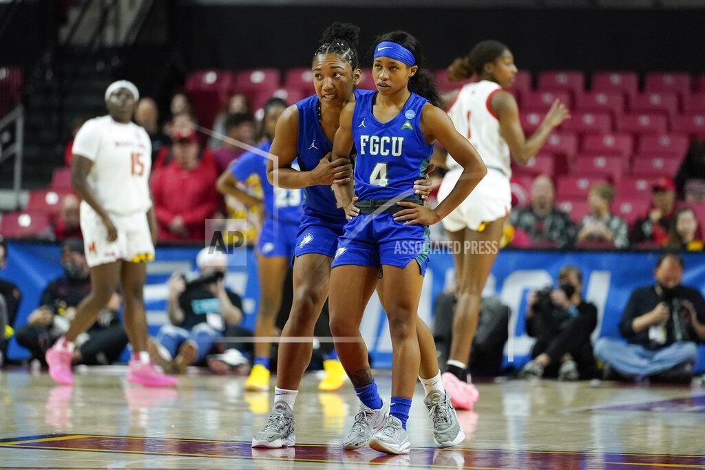 Julio Cortez Florida Gulf Coast guard Kerstie Phills, left, talks to guard Tishara Morehouse (4) during the first half of a college basketball game against Maryland in the second round of the NCAA tournament, Sunday, March 20, 2022, in College Park, Md. (AP Photo/Julio Cortez)