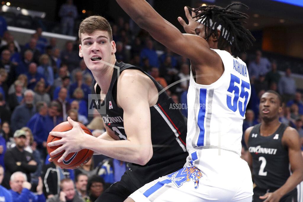 Karen Pulfer Focht Memphis' forward Precious Achiuwa (55) defends Cincinnati's center Chris Vogt (33) in the first half of an NCAA college basketball game Thursday, Jan. 16, 2020, in Memphis, Tenn. (AP Photo/Karen Pulfer Focht)