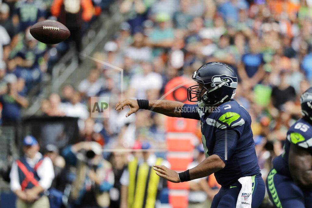 John Froschauer Seattle Seahawks quarterback Russell Wilson passes against the Cincinnati Bengals during the first half of an NFL football game, Sunday, Sept. 8, 2019, in Seattle. (AP Photo/John Froschauer)