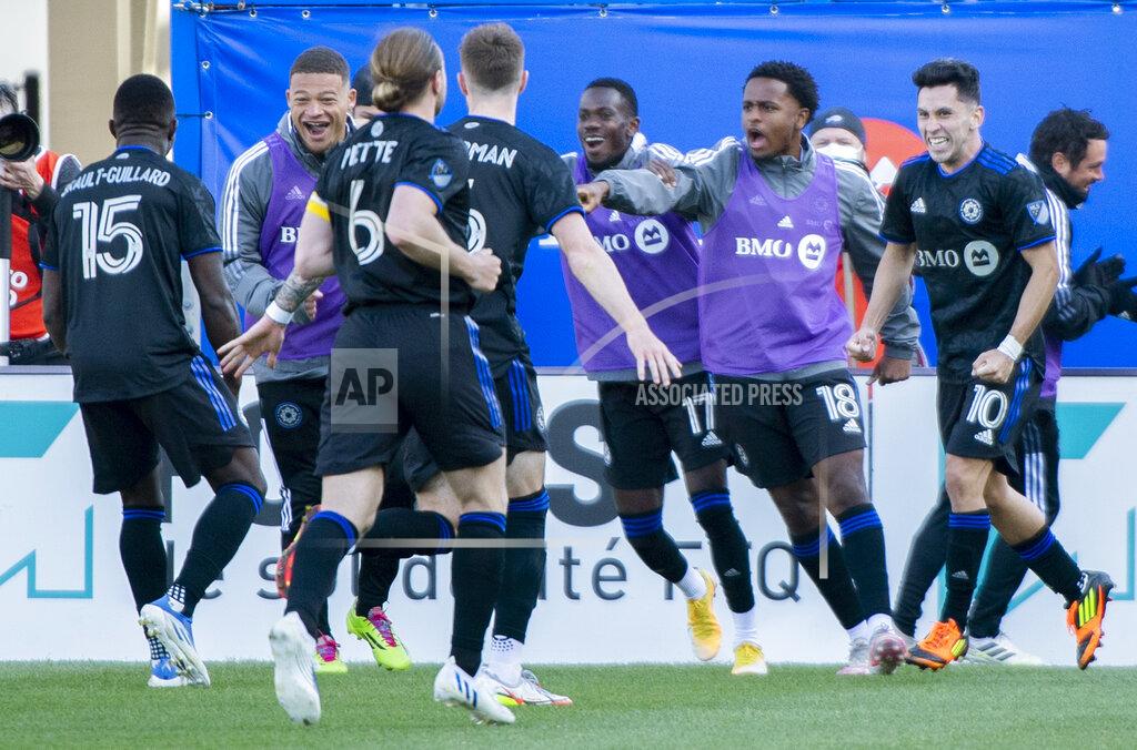 Graham Hughes CF Montreal players celebrate a goal by Joaquin Torres (10) against Orlando City during the second half of an MLS soccer game in Montreal, Saturday, May 7, 2022. (Graham Hughes/The Canadian Press via AP)