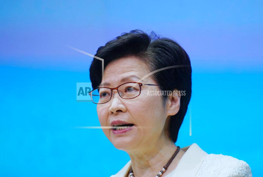 Vincent Yu Hong Kong Chief Executive Carrie Lam speaks during a news conference in Hong Kong, Tuesday, May 11, 2021. Lam announced Hong Kong officials have dropped a plan to make it mandatory for foreign domestic workers to be vaccinated against the coronavirus, after the move drew criticism that it was discriminatory. (AP Photo/Vincent Yu)