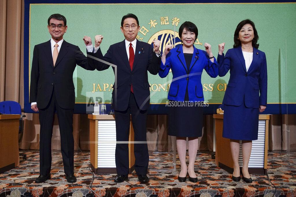 Eugene Hoshiko FILE - In this Sept. 18, 2021, file photo, candidates for the presidential election of the ruling Liberal Democratic Party pose prior to a debate session hosted by the Japan National Press Club in Tokyo. The stakes are high as Japanese governing party members vote Wednesday, Sept. 29, 2021 for the four candidates seeking to replace Yoshihide Suga as prime minister. The next leader must address a pandemic-battered economy, a newly empowered military operating in a dangerous neighborhood, crucial ties with an inward-focused ally, Washington, and tense security standoffs with an emboldened China and its ally North Korea. (AP Photo/Eugene Hoshiko, Pool, File)