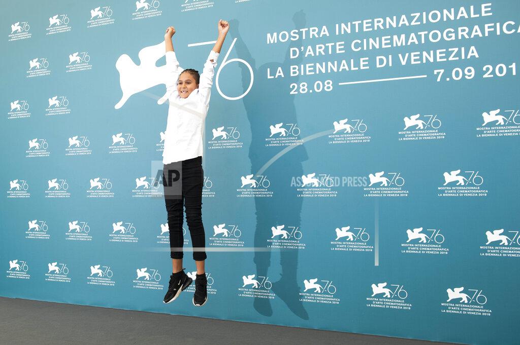 Arthur Mola File - Actor Petr Kotlar jumps in the air at a photo call for "The Painted Bird' during the Venice Film Festival. The 77th Venice Film Festival will kick off on Wednesday, Sept. 2, 2020, but this year's edition will be unlike any others. Coronavirus restrictions will mean fewer Hollywood stars, no crowds interacting with actors and other virus safeguards will be deployed. (Photo by Arthur Mola/Invision/AP, File)
