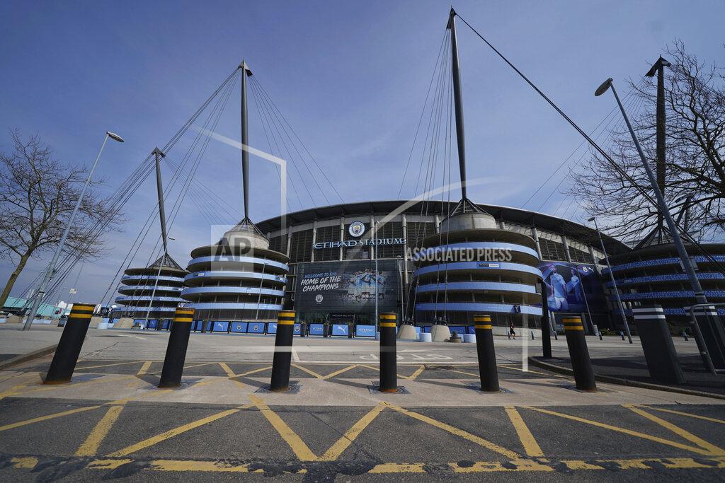 Jon Super Bollards stand raised outside the closed Manchester City Etihad Stadium, in Manchester, northern England, as the English Premier League soccer season has been suspended due to coronavirus, Thursday, April 9, 2020. The new coronavirus causes mild or moderate symptoms for most people, but for some, especially older adults and people with existing health problems, it can cause more severe illness or death. (AP Photo/Jon Super)