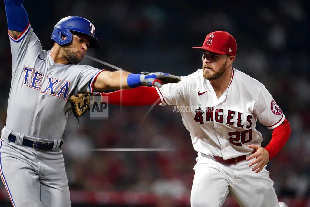 Marcio Jose Sanchez Los Angeles Angels first baseman Jared Walsh, right, tags out Texas Rangers' Jason Martin along the first base line after a ground ball during the seventh inning of a baseball game Monday, Sept. 6, 2021, in Anaheim, Calif. (AP Photo/Marcio Jose Sanchez)