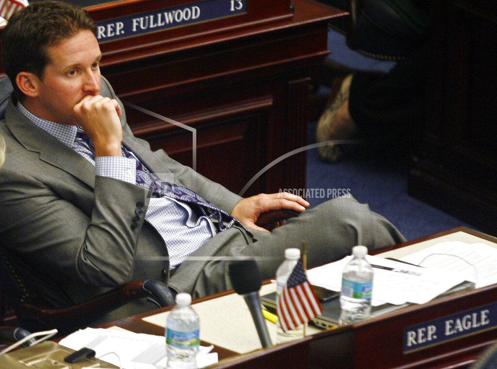 FILE - In this April 24, 2014, file photo, Rep. Dane Eagle, R-Cape Coral, listens to a debate on the floor of the House of Representatives, in Tallahassee, Fla. Gov. Ron DeSantis announced Wednesday, Sept. 2, 2020, that he has appointed Eagle as the new executive director of the Florida Department of Economic Opportunity. (AP Photo/Steve Cannon, File)