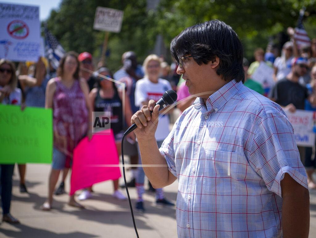 Doug Mcschooler Gabriel Whitley, of Young Conservatives of Southern Indiana, was the organizer of the One Million Hoosier March that drew about 200 activists who gathered on the south lawn of the Indiana State House Saturday, Aug. 8, 2020, to protest any government mandate that would require them to wear masks as protection against the spread of COVID-19. (Doug McSchooler/The Indianapolis Star via AP)
