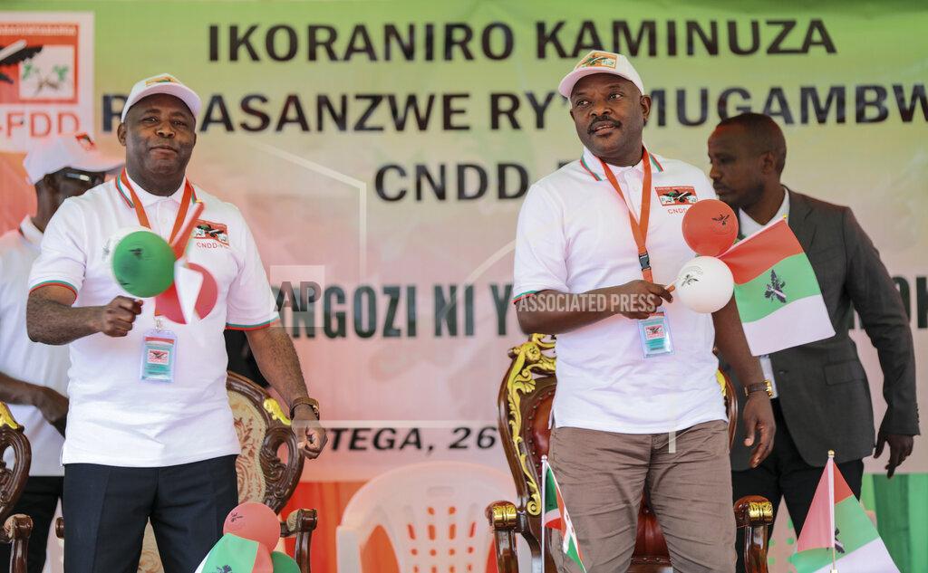 Berthier Mugiraneza FILE - In this Jan. 26, 2020, file photo, Burundi Army Gen. Evariste Ndayishimiye, left, is accompanied by president Pierre Nkurunziza, right, after Ndayishimiye was chosen as the party's presidential candidate at a national conference for the ruling CNDD-FDD party in the rural province of Gitega, Burundi. Burundi's government said Tuesday, June 9, 2020 that President Pierre Nkurunziza has died of a heart attack. (AP Photo/Berthier Mugiraneza, File)
