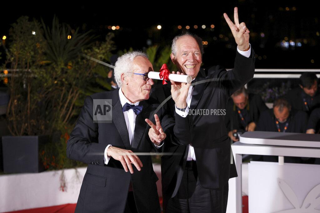 Vianney Le Caer Directors Luc Dardenne, left, and Jean-Pierre Dardenne, winners of the 75th anniversary prize for 'Tori and Lokia,' pose for photographers during the photo call following the awards ceremony at the 75th international film festival, Cannes, southern France, Saturday, May 28, 2022. (Photo by Vianney Le Caer/Invision/AP)