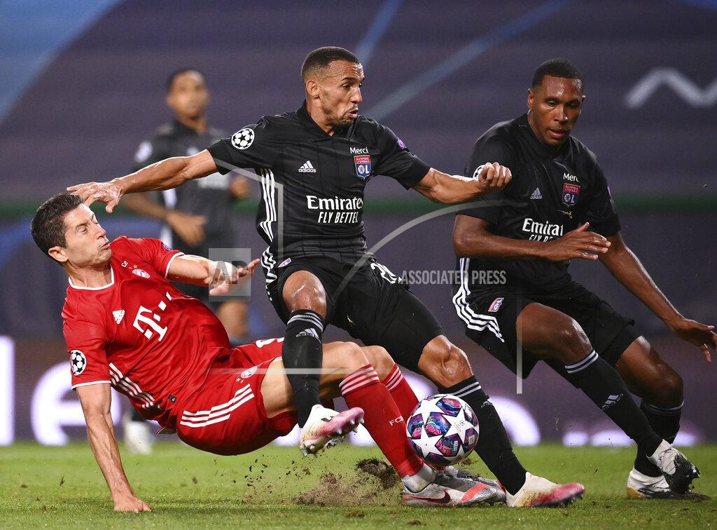 Franck Fife Lyon's Marcal, centre, duels for the ball with Bayern's Robert Lewandowski during the Champions League semifinal soccer match between Lyon and Bayern at the Jose Alvalade stadium in Lisbon, Portugal, Wednesday, Aug. 19, 2020. (Franck Fife/Pool via AP)