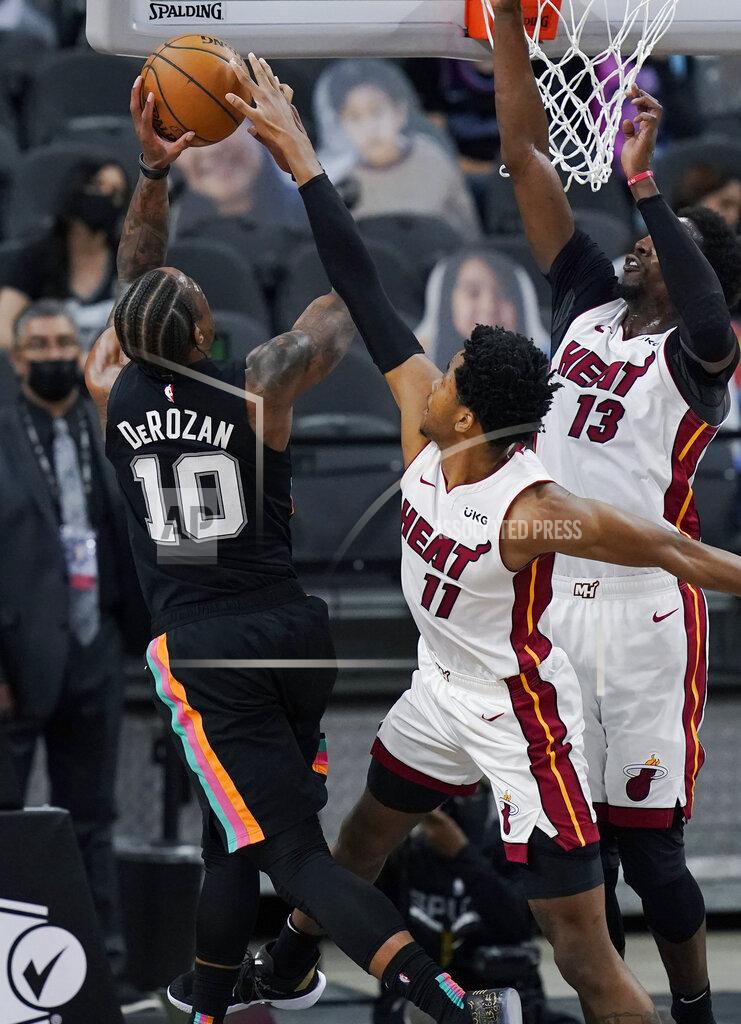 Eric Gay San Antonio Spurs forward DeMar DeRozan (10) is blocked by Miami Heat forward KZ Okpala (11) during the second half of an NBA basketball game in San Antonio, Wednesday, April 21, 2021. (AP Photo/Eric Gay)
