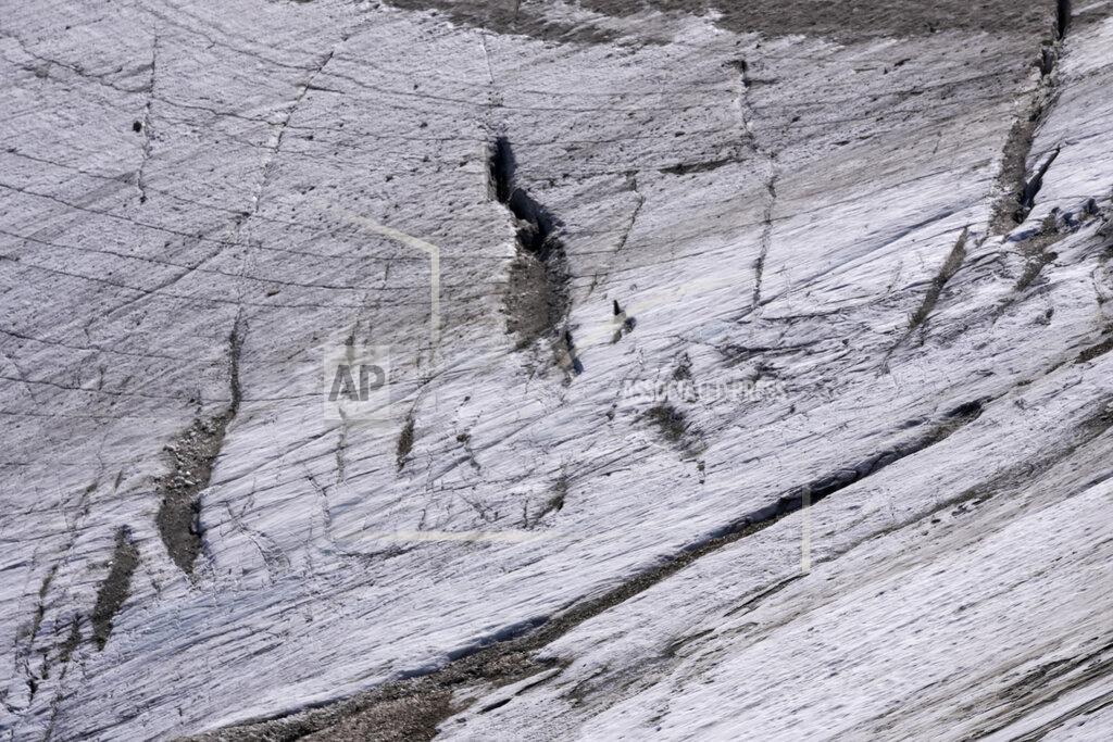 Luca Bruno Crevasses are seen on the Punta Rocca glacier near Canazei, in the Italian Alps in northern Italy, Tuesday, July 5, 2022, two day after a huge chunk of the glacier broke loose, sending an avalanche of ice, snow, and rocks onto hikers. (AP Photo/Luca Bruno)