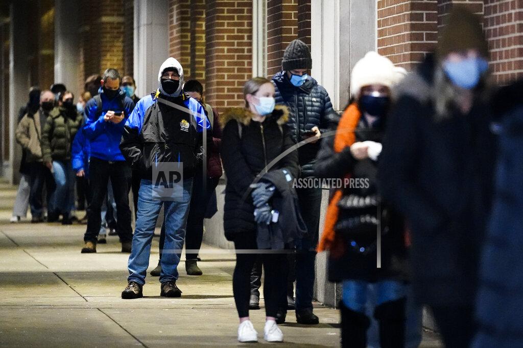Matt Rourke People wait in line at a COVID-19 vaccination site at the Pennsylvania Convention Center in Philadelphia, Wednesday, Feb. 3, 2021. The clinic opened to help provide second doses of COVID-19 vaccinations. (AP Photo/Matt Rourke)