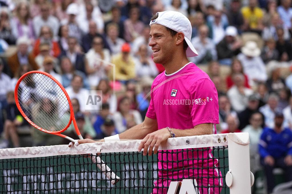 Michel Euler Argentina's Diego Schwartzman smiles at the net as he plays Bulgaria's Grigor Dimitrov during their third round match of the French Open tennis tournament at the Roland Garros stadium Friday, May 27, 2022 in Paris. (AP Photo/Michel Euler)