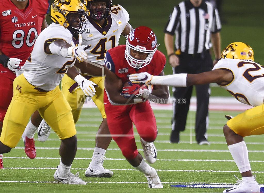 Eric Paul Zamora Fresno State's Ronnie Riveres, center, tries to run up the middle against Minnesota during an NCAA college football game Saturday, Sept. 7, 2019, in Fresno, Calif. (Eric Paul Zamora/The Fresno Bee via AP)