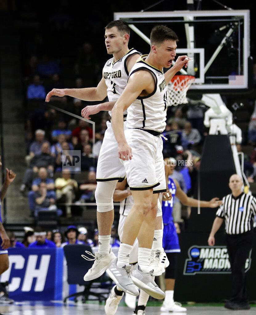 John Raoux Wofford's Fletcher Magee, left, and Nathan Hoover celebrate after Magee made a 3-point shot against Seton Hall during the second half of a first-round game in the NCAA men’s college basketball tournament in Jacksonville, Fla., Thursday, March 21, 2019. (AP Photo/John Raoux)