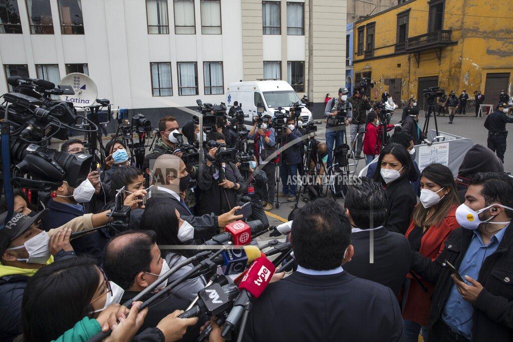 Rodrigo Abd Reporters interview a lawmaker outside Congress in Lima, Peru, Friday, Sept. 18, 2020. Peruvian President Martin Vizcarra's job is on the line Friday as opposition lawmakers push through an impeachment hearing criticized as a hasty and poorly timed ouster attempt in one of the countries hardest hit by the coronavirus pandemic. (AP Photo/Rodrigo Abd)