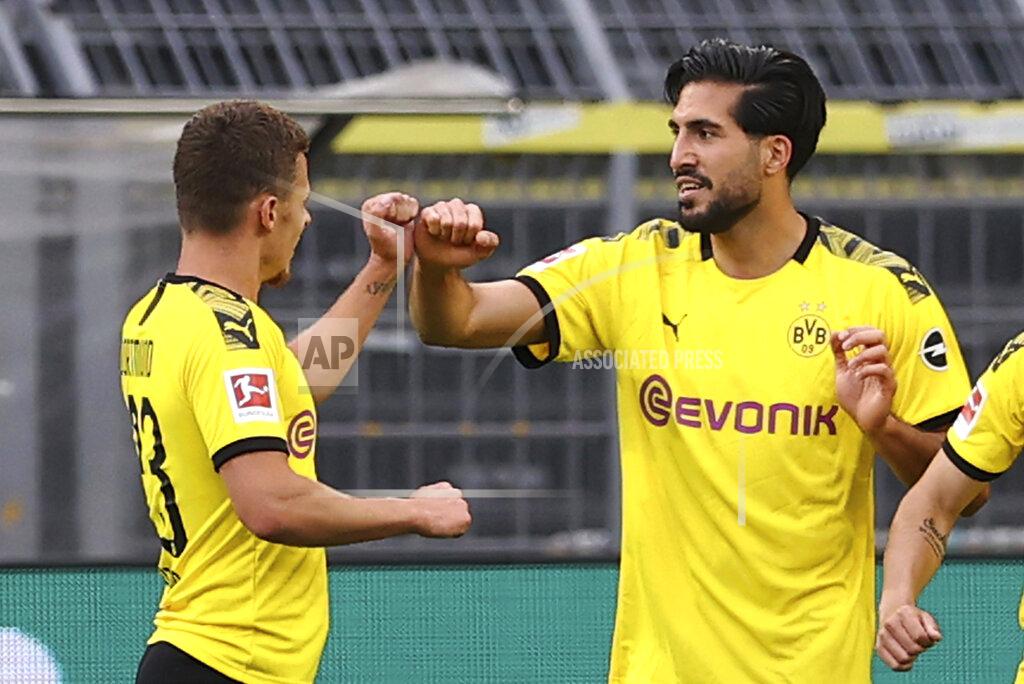 Lars Baron Emre Can of Borussia Dortmund cheers on his goal during the German Bundesliga soccer match between Borussia Dortmund and Hertha BSC Berlin in Dortmund , Germany, Saturday, June 6, 2020. (Lars Baron, Pool via AP)