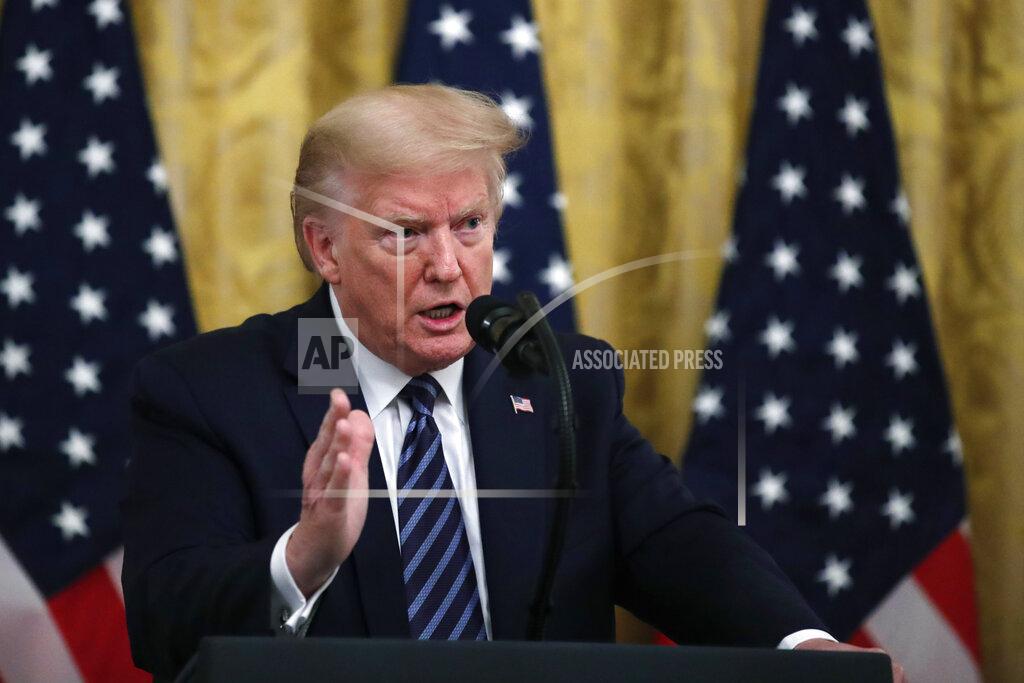 President Donald Trump answers questions from reporters during a event about protecting seniors, in the East Room of the White House, Thursday, April 30, 2020, in Washington. (AP Photo/Alex Brandon)