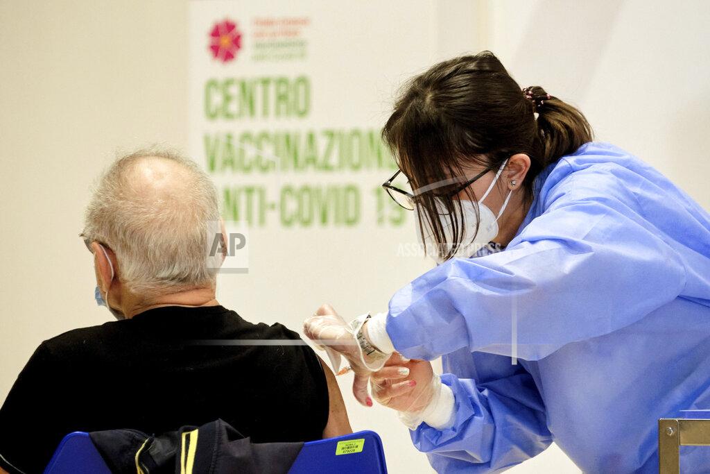 Mauro Scrobogna A person receives his shot of vaccine against Covid-19 as the vaccination campaign continues on Easter Day in Rome, Sunday, April 4, 2021. Italy has entered a three-day strict nationwide lockdown to prevent new surges of the coronavirus. Police set up road checks to ensure people were staying close to home and extra patrols were ordered up to break up large gatherings in squares and parks, which over Easter weekend are usually packed with picnic-goers. (Mauro Scrobogna/LaPresse via AP)