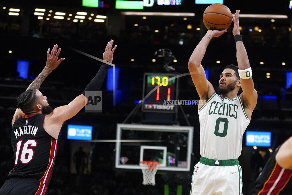 Charles Krupa Boston Celtics forward Jayson Tatum (0) shoots over Miami Heat forward Caleb Martin (16) during the second half of Game 4 of the NBA basketball playoffs Eastern Conference finals, Monday, May 23, 2022, in Boston. (AP Photo/Charles Krupa)