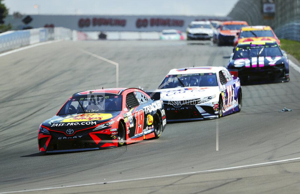 John Munson Martin Truex, Jr., and Denny Hamlin head into Turn 1 during a NASCAR Cup Series auto race at Watkins Glen International, Sunday, Aug. 4, 2019, in Watkins Glen, N.Y. (AP Photo/John Munson)
