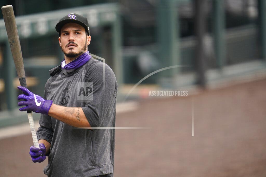 David Zalubowski Colorado Rockies' Nolan Arenado warms up before a baseball game against the Los Angeles Dodgers, Saturday, Sept. 19, 2020, in Denver. (AP Photo/David Zalubowski)