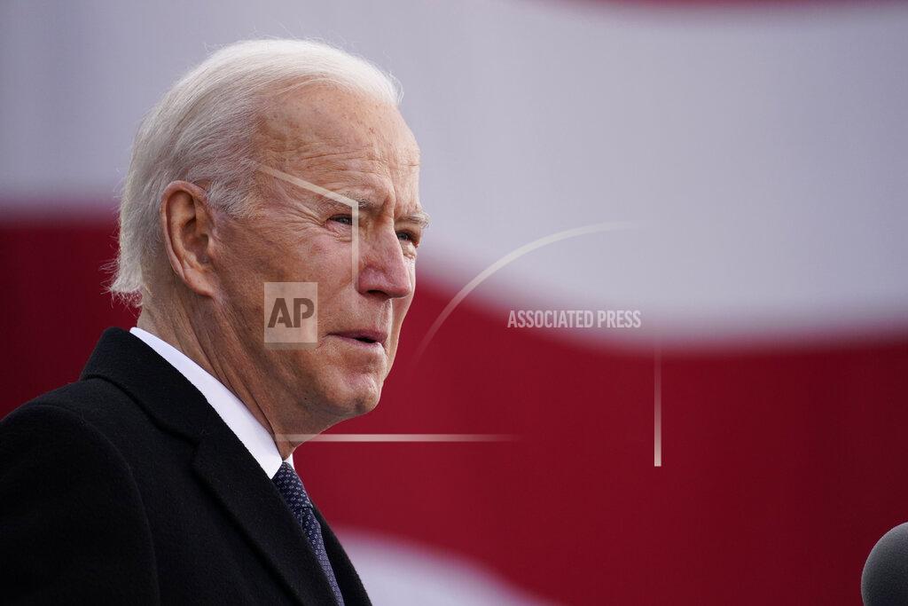 Evan Vucci President-elect Joe Biden speaks at the Major Joseph R. "Beau" Biden III National Guard/Reserve Center, Tuesday, Jan. 19, 2021, in New Castle, Del. (AP Photo/Evan Vucci)