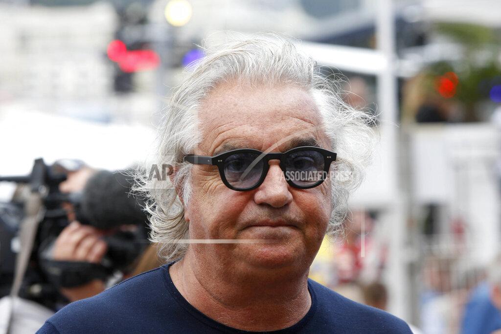 Luca Bruno Former F1 Renault Team principal Flavio Briatore attends the Formula One Grand Prix, at the Monaco racetrack, in Monaco, Sunday, May 24, 2015. On Tuesday Aug. 25, 2020, Briatore has reportedly been admitted to hospital in Milan with coronavirus, there has been no official statement from the hospital but multiple reports say Briatore’s condition is serious but he is not in intensive care. (AP Photo/Luca Bruno)