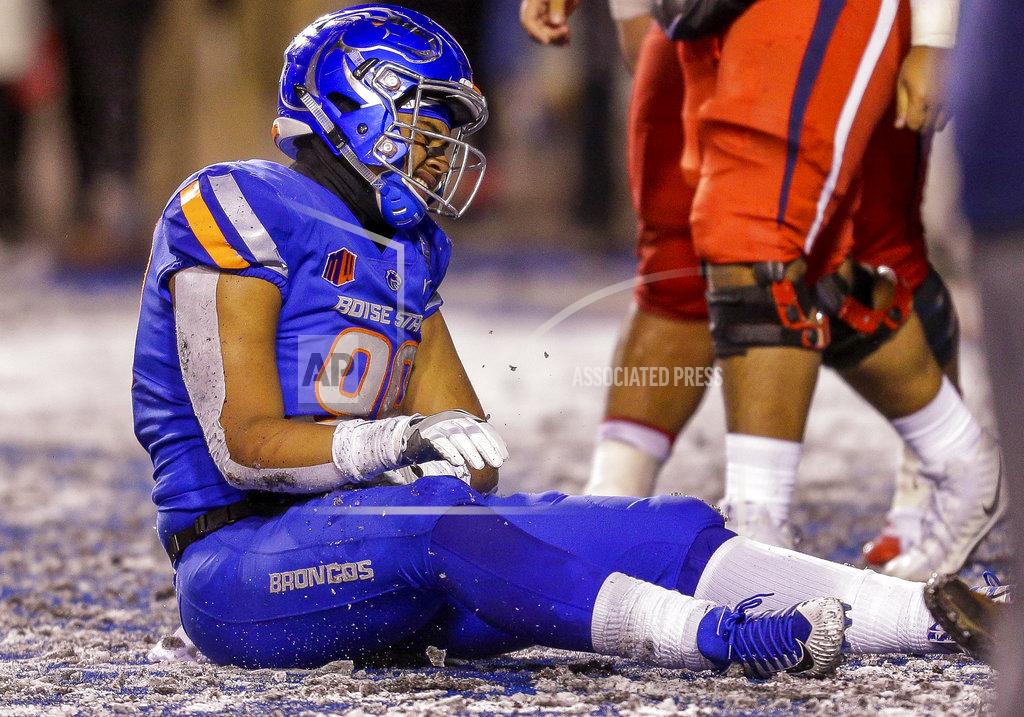 Steve Conner Boise State linebacker Curtis Weaver sits on the field after the team's 19-16 loss to Fresno State in an NCAA college football game for the Mountain West championship Saturday, Dec. 1, 2018, in Boise, Idaho. (AP Photo/Steve Conner)