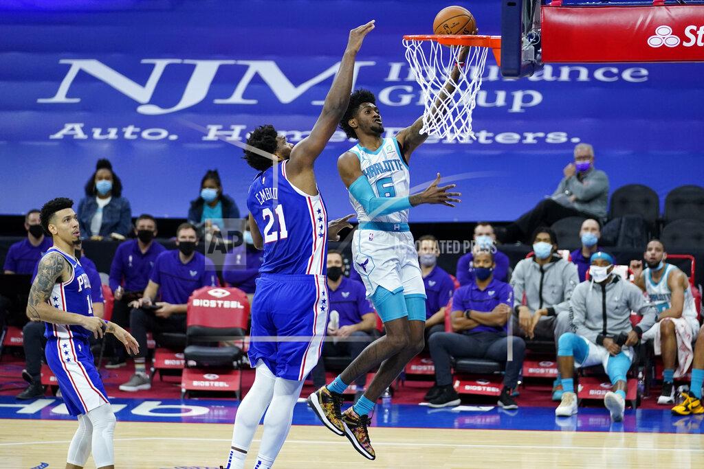 Matt Slocum Charlotte Hornets' Jalen McDaniels (6) goes up for a shot past Philadelphia 76ers' Joel Embiid (21) during the first half of an NBA basketball game, Monday, Jan. 4, 2021, in Philadelphia. (AP Photo/Matt Slocum)