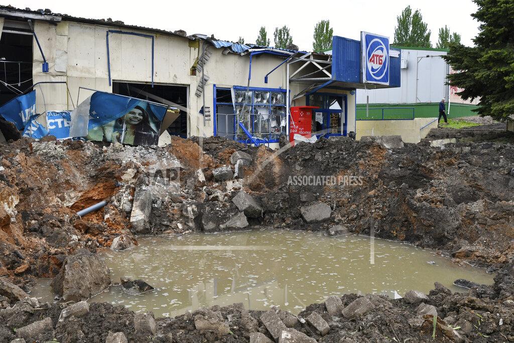 Andriy Andriyenko A crater of an explosion is seen after Russian shelling in Soledar, Donetsk region, Ukraine, Wednesday, May 18, 2022. (AP Photo/Andriy Andriyenko)