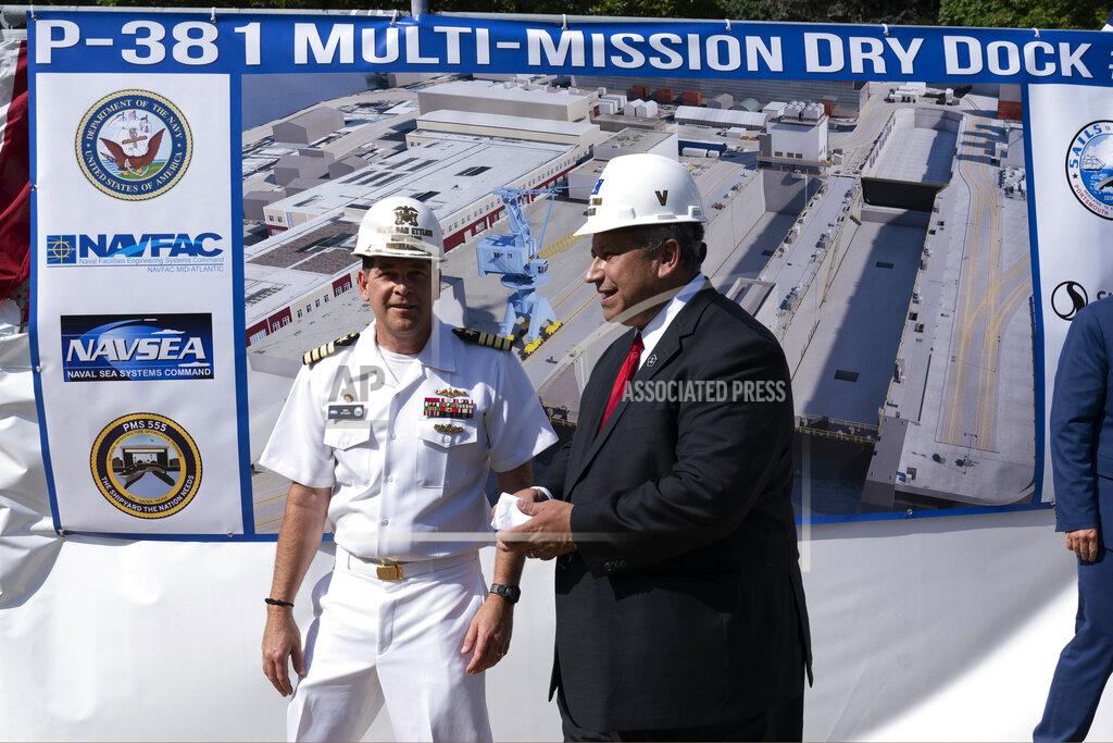 Robert F. Bukaty Shipyard Commander Capt. Dan Ettlich, left, and Navy Secretary Carlos Del Toro, attend a groundbreaking ceremony for a $1.7 billion dry dock project at Portsmouth Naval Shipyard, Wednesday, Sept. 8, 2021, in Kittery, Maine. King is recovering from COVID-19. (AP Photo/Robert F. Bukaty)