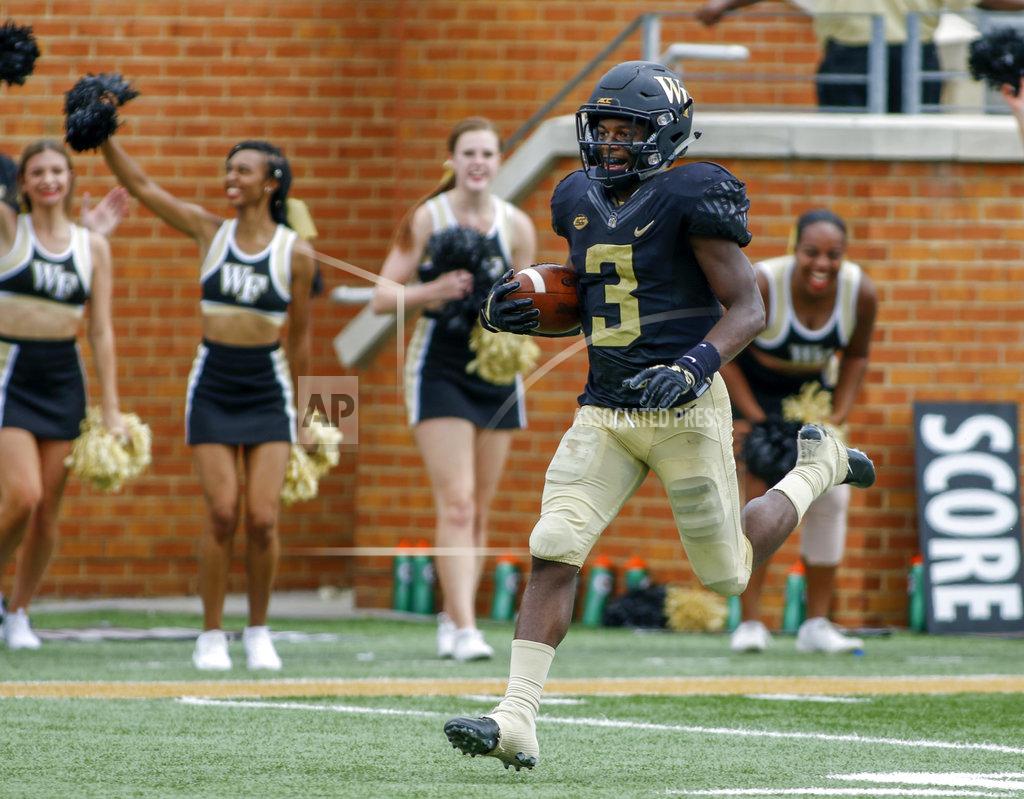 Nell Redmond Wake Forest punt returner Greg Dortch runs back a punt for a touchdown against Towson in the first half of a NCAA college football game in Winston-Salem, N.C., Saturday, Sept. 8, 2018. (AP Photo/Nell Redmond)