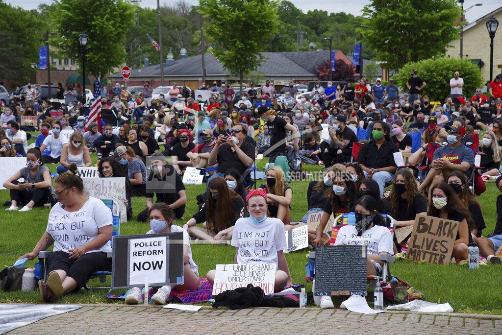 John Starks Two men have a discussion at a Black Lives Matter rally at the Peg Bond Pavilion in Batavia, Ill., Wednesday, June 3, 2020, during a protest over the death of George Floyd, a black man who was killed while in police custody in Minneapolis on May 25. (John Starks/Daily Herald via AP)
