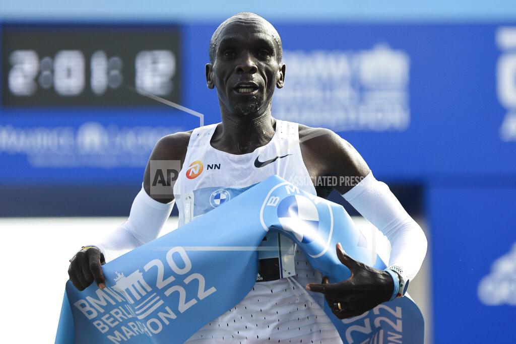 Christoph Soeder Kenya's Eliud Kipchoge crosses the line to win the Berlin Marathon in Berlin, Germany, Sunday, Sept. 25, 2022. Olympic champion Eliud Kipchoge has bettered his own world record in the Berlin Marathon. Kipchoge clocked 2:01:09 on Sunday to shave 30 seconds off his previous best-mark of 2:01:39 from the same course in 2018. (AP Photo/Christoph Soeder)