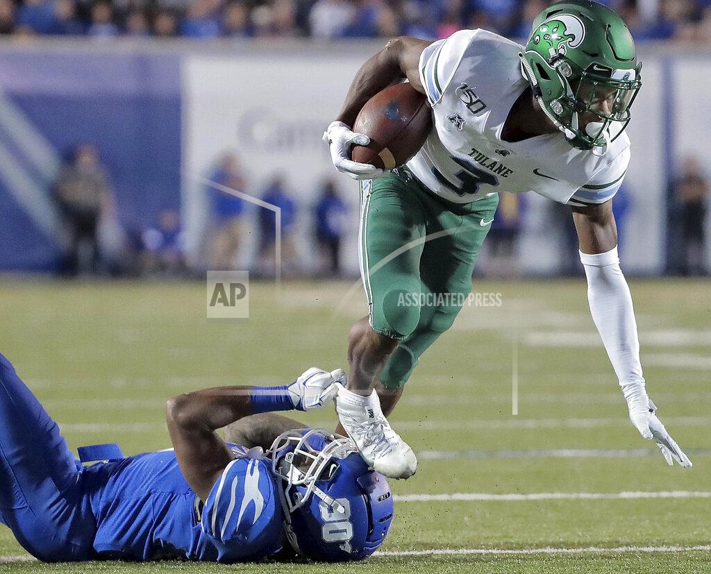 Jim Weber Memphis defensive back T.J. Carter trips Tulane's P.J. Hall during an NCAA college football game Saturday, Oct. 19, 2019, in Memphis, Tenn. (Jim Weber/Daily Memphian via AP)