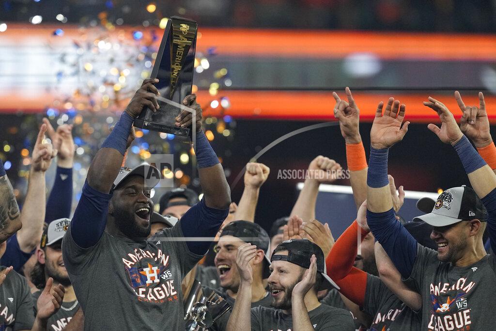 Tony Gutierrez Houston Astros designated hitter Yordan Alvarez holds the trophy after their win against the Boston Red Sox in Game 6 of baseball's American League Championship Series Friday, Oct. 22, 2021, in Houston. The Astros won 5-0, to win the ALCS series in game six. (AP Photo/Tony Gutierrez)