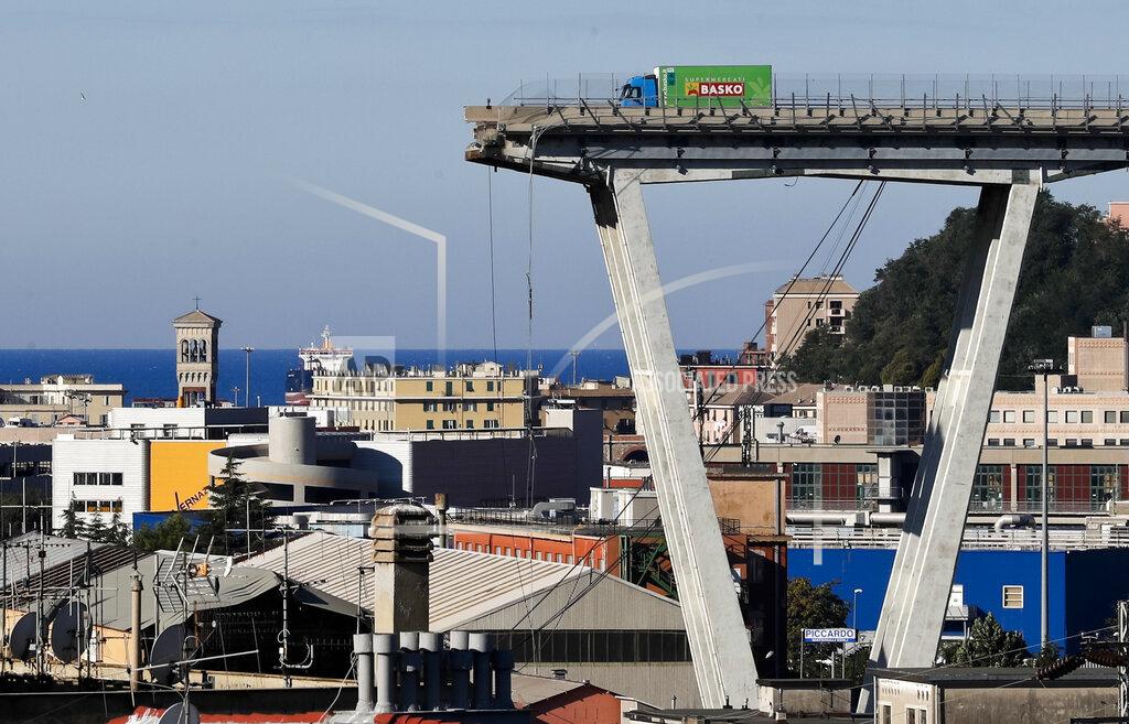 Antonio Calanni FILE - A Wednesday, Aug. 15, 2018 file photo showing a view of the Morandi highway bridge that collapsed in Genoa, northern Italy. Fifty-nine people went on trial Thursday, July 7, 2022, for the 2018 collapse of Genoa's Morandi bridge, accused of manslaughter and other charges in the deaths of 43 people. (AP Photo/Antonio Calanni, File)