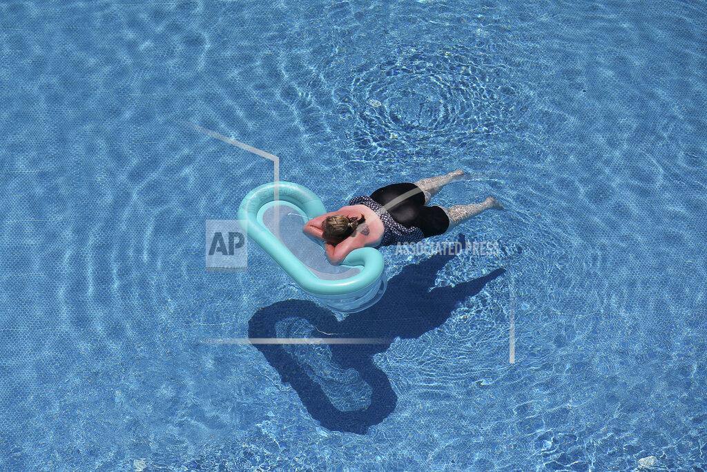 Emrah Gurel A tourist relaxes in a swimming pool at a hotel in Antalya, southern Turkey, Saturday, June 19, 2021. Hotels in Turkey's Antalya region, a destination beloved by holidaymakers, are preparing to finally resume operations as they expect the return of international tourists after months of setbacks caused by the pandemic that halted travel. (AP Photo/Emrah Gurel)