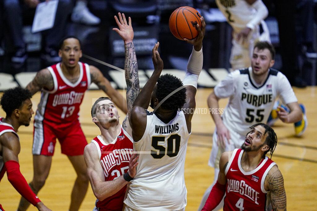 Michael Conroy Purdue forward Trevion Williams (50) shoots over Ohio State forward Kyle Young (25) during the second half of an NCAA college basketball game in West Lafayette, Ind., Wednesday, Dec. 16, 2020. (AP Photo/Michael Conroy)